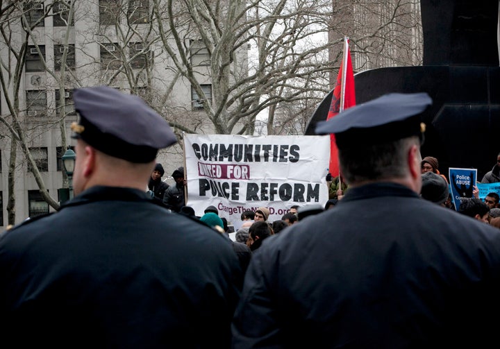 NEW YORK, NY - MARCH 18: New York CIty Police officers watch over a demonstration against the city's 'stop and frisk' searches in lower Manhattan near Federal Court March 18, 2013 in New York City. Hearings in a federal lawsuit filed by four black men against the city police department's 'stop and frisk' searches starts today in Manhattan Federal Court. (Photo by Allison Joyce/Getty Images)