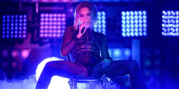 LOS ANGELES, CA - JANUARY 26: Singer Beyonce performs onstage during the 56th GRAMMY Awards at Staples Center on January 26, 2014 in Los Angeles, California. (Photo by Kevork Djansezian/Getty Images)