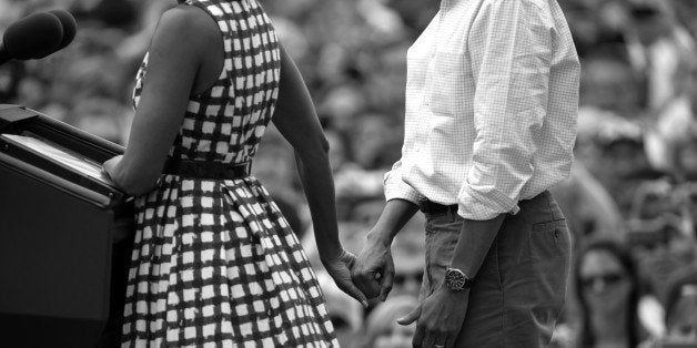 DUBUQUE, IOWA: AUGUST 15 -- With the First Lady Michelle Obama at his side, President Barack Obama speaks during a rally at Alliant Energy Amphitheater in Dubuque, Iowa, on Wednesday, August 15, 2012. (Photo By Nikki Kahn/The Washington Post via Getty Images)