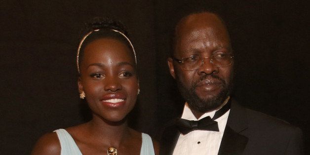 HOLLYWOOD, CA - MARCH 02: Actress Lupita Nyong'o, winner of Best Performance by an Actress in a Supporting Role (L) and Peter Anyang' Nyong'o backstage during the Oscars held at Dolby Theatre on March 2, 2014 in Hollywood, California. (Photo by Christopher Polk/Getty Images)