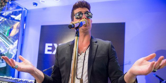 NEW YORK, NY - MARCH 25: Singer Robin Thicke performs during the grand opening of EXPRESS Times Square on March 25, 2014 in New York City. (Photo by Michael Stewart/WireImage)