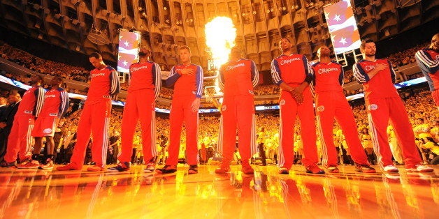 OAKLAND, CA - MAY 1: The Los Angeles Clippers stand for the National Anthem before a game against the Golden State Warriors in Game Six of the Western Conference Quarterfinals during the NBA Playoffs at Oracle Arena on May 1, 2014 in Oakland, California. NOTE TO USER: User expressly acknowledges and agrees that, by downloading and/or using this Photograph, user is consenting to the terms and conditions of the Getty Images License Agreement. Mandatory Copyright Notice: Copyright 2014 NBAE (Photo by Noah Graham/NBAE via Getty Images)