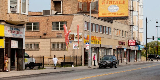 CHICAGO, IL - AUGUST 19: People walk through a commercial area in the Englewood neighborhood, on August 19, 2013 in Chicago, Illinois. Englewood is a depressed neighborhood of Chicago with a high crime rate that has been hit even harder by the sluggish economy. Some people are moving out to the suburbs to escape the violence. (Photo by Melanie Stetson Freeman/The Christian Science Monitor via Getty Images)