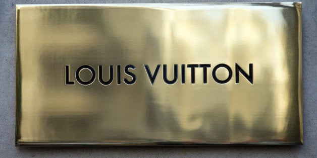 The Louis Vuitton store name is pictured above the facade of a shop, on December 26, 2012 in Paris. AFP PHOTO / JOEL SAGET (Photo credit should read JOEL SAGET/AFP/Getty Images)