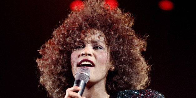 A file picture taken on May 18, 1988 in Paris shows US singer Whitney Houston performing at the POPB (Bercy hall). Grammy-winning pop legend and actress Whitney Houston, 48, was found dead on February 11, 2012 in a Beverly Hills hotel, police said. AFP PHOTO BERTRAND GUAY (Photo credit should read BERTRAND GUAY/AFP/GettyImages)