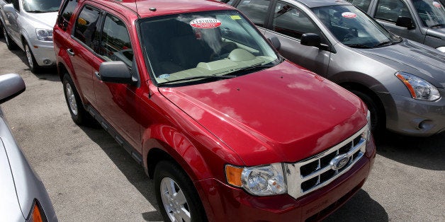 MIAMI, FL - MAY 30: A 2010 Ford Escape is seen on a used car lot on May 30, 2014 in Miami, Florida. Ford announced a recall of Ford Escapes from the 2008 to 2011 model year to fix a problem with a torque sensor within the steering column along with the Escape the company is recalling the 2011 to 2013 Explorer and the Taurus. (Photo by Joe Raedle/Getty Images)