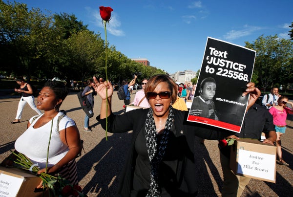 Missouri state Sen. Jamilah Nasheed (D) walks during a rally for justice for Michael Brown, and the people of Ferguson, Misso