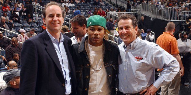 ATLANTA - JANUARY 25: Rapper Nelly poses with Atlanta Hawks Owners Michael Gearon (L) and Bruce Levenson (R) during the game against the Cleveland Cavaliers on January 25, 2006 at Philips Arena in Atlanta, Georgia. NOTE TO USER: User expressly acknowledges and agrees that, by downloading and/or using this Photograph, user is consenting to the terms and conditions of the Getty Images License Agreement. Mandatory Copyright Notice: Copyright 2006 NBAE (Photo by Scott Cunningham/NBAE via Getty Images)