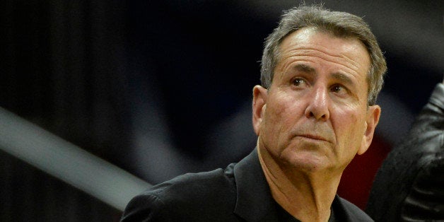 Atlanta Hawks co-owner Bruce Levenson watches from his courtside seat in the second half of their NBA basketball game against the Washington Wizards on Friday, Dec. 13, 2013, in Atlanta. Atlanta won 101-99 in overtime. (AP Photo/David Tulis)