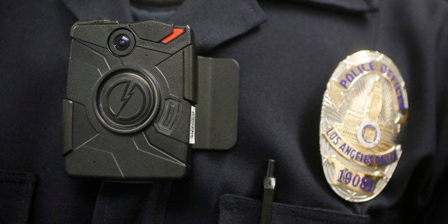 This Jan. 15, 2014 file photo shows a Los Angeles Police officer wearing an on-body cameras during a demonstration for media