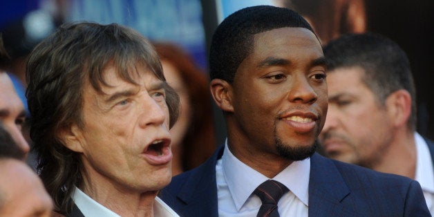 Mick Jagger and Chadwick Boseman attend the premiere of Universal Pictures' "Get On Up" at the Apollo Theater in New York on July 21, 2014.