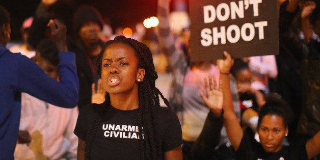 ST LOUIS, MO - OCTOBER 09: Demonstrators march through the streets protesting the October 8 killing of 18-year-old Vonderrit
