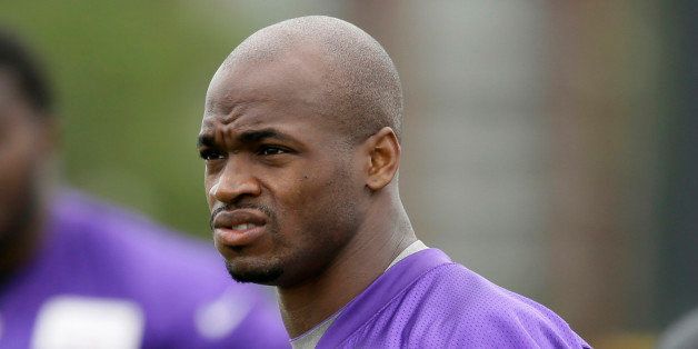 FILE - In this July 28, 2014, file photo, Minnesota Vikings running back Adrian Peterson looks on during NFL football training camp in Mankato, Minn. Peterson acknowledges he struck his young son with a branch, but insists he did not commit a crime. That belief is to draw further attention this week when the case against the Vikings' star running back goes before a Texas judge. (AP Photo/Charlie Neibergall, File)