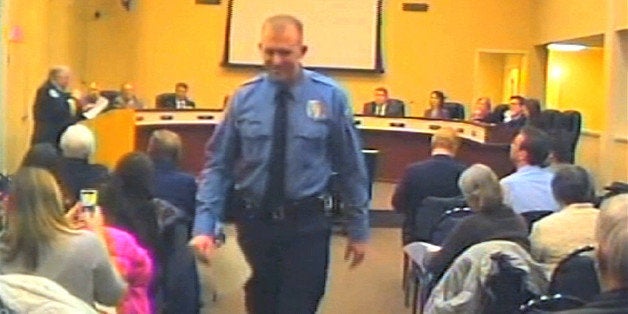 FILE - In this Feb. 11, 2014 file image from video provided by the City of Ferguson, Mo., officer Darren Wilson attends a city council meeting in Ferguson. Police identified Wilson, 28, as the police officer who shot 18-year-old Michael Brown on Aug. 9, 2014 in Ferguson, Mo. (AP Photo/City of Ferguson, File)