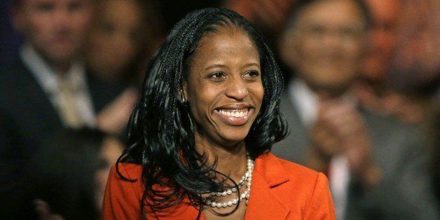 In this Wednesday, Oct. 8, 2014, photo, Mia Love, the Republican nominee in Utahâs 4th congressional district, smiles after speaking during a rally, in Lehi, Utah. Former Republican presidential nominee Mitt Romney, hosted the rally and fundraiser for Mia Love. (AP Photo/Rick Bowmer)