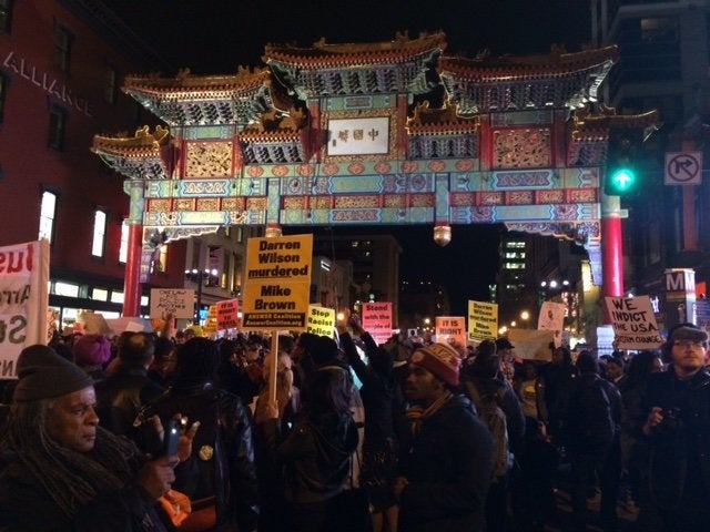 Protesters gather in Washington, D.C.'s Chinatown Tuesday evening.