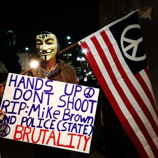 People protest the Darren Wilson Grand Jury decision in Dallas, Texas, on November 25, 2014.