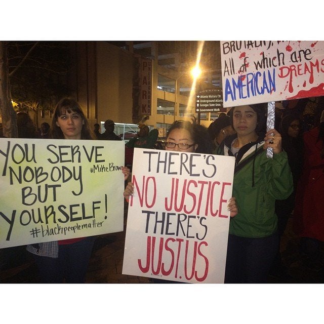 People protest the Darren Wilson Grand Jury decision in Atlanta, Georgia, on November 25, 2014.