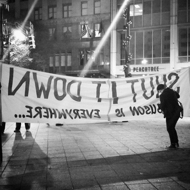 People protest the Darren Wilson Grand Jury decision in Atlanta, Georgia, on November 25, 2014.