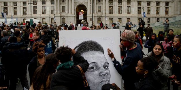 Protesters demonstrate, Tuesday, Nov. 25, 2014, in Philadelphia, the day after a grand jury's decision not to indict a white Ferguson, Mo., police officer who killed 18-year-old black Michael Brown. (AP Photo/Matt Rourke)