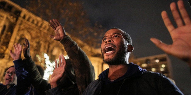 OAKLAND, CA - DECEMBER 3: Protesters demonstrate following a Staten Island, New York grand jury's decision not to indict a police officer in the chokehold death of Eric Garner on December 3, 2014 in Oakland, California. The grand jury declined to indict New York City Police Officer Daniel Pantaleo in Garner's death. (Photo by Elijah Nouvelage/Getty Images)