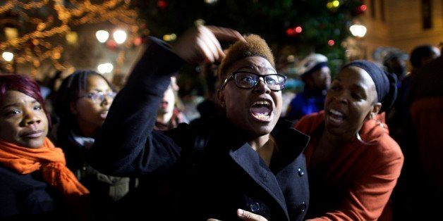 PHILADELPHIA, PA - DECEMBER 3: Demonstrators gather in Philadelphia to protest the Eric Garner grand jury decision during a Christmas Tree lighting ceremony at City Hall December 3, 2014 in Philadelphia, Pennsylvania. Organizers called for the demonstration after a grand jury in the Staten Island borough of New York City declined to indict the police officer who used a chokehold on Garner, resulting in his death. (Photo by Mark Makela/Getty Images)