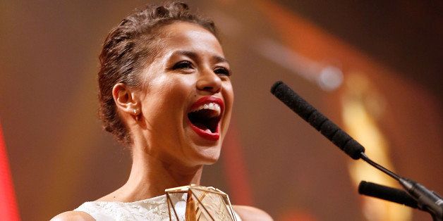 LONDON, ENGLAND - DECEMBER 07: Gugu Mbatha-Raw with the award for Best Actress for 'Belle', on stage during The Moet British Independent Film Awards at Old Billingsgate Market on December 7, 2014 in London, England. (Photo by Tristan Fewings/Getty Images for The Moet British Independent Film Awards)