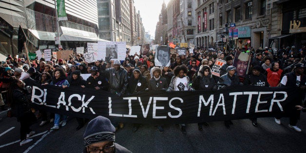 Demonstrators march in New York, Saturday, Dec. 13, 2014, during the Justice for All rally and march. In the past three weeks