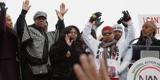 WASHINGTON, DC - DECEMBER 13: (L-R) Kadiatou Diallo, mother of Amadou Diallo; Sybrina Fulton, the mother of Trayvon Martin; Samaira Rice, the mother of Tamir Rice; Lesley McSpadden, the mother of Michael Brown Jr; and Rev. Al Sharpton raise their hands in the air during the 'Justice For All' march and rally through the nation's capital December 13, 2014 in Washington, DC. Organized by Sharpton's National Action Network, this march and others like it across the country aim to tell Congress and the country that demonstrators will not stand down until there is systemic change, accountability and justice in cases of police misconduct. Sharpton said the demonstration is happening in Washington 'because all over the country we all need to come together and demand this Congress deal with the issues, that we need laws to protect the citizens in these states from these state grand jurors.' (Photo by Chip Somodevilla/Getty Images)