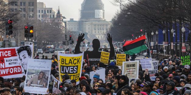 WASHINGTON, DC - DEC13: Demonstrators listen to speeches at Freedom Plaza at the start of the March on Washington, December 13, 2014, in Washington, DC. (Photo by Evelyn Hockstein/For The Washington Post via Getty Images)