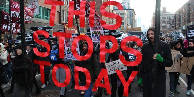 NEW YORK, NY - DECEMBER 13: Thousands of protestors converge on Manhattan's Washington Square Park to march through the Manha