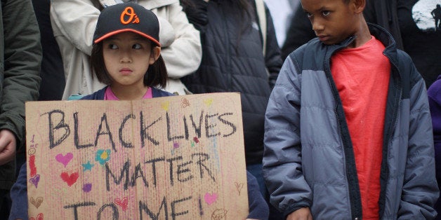 LOS ANGELES, CA - DECEMBER 5: Protesters rally near LAPD headquarters December 5, 2014 in Los Angeles, California. The decision follows a similar ruling last week in which white Ferguson, Missouri police officer Darren Wilson was not indicted in the shooting death of unarmed black teenager Michael Brown. Those protests resulted in hundreds of arrests in Los Angeles. (Photo by David McNew/Getty Images)