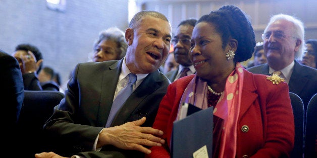 U.S. Rep. William Lacy Clay, D-Mo., left, talks with fellow Congressional Black Caucus member Rep. Shelia Jackson-Lee, D-Texas, during a service at Wellspring Church, Sunday, Jan. 18, 2015, in Ferguson, Mo. Several members of the caucus spoke during the service about Martin Luther King Jr., a day before a federal holiday honoring the civil rights leader, as well as their desire to reform police procedures after the death of Michael Brown and other fatal police shootings nationwide. (AP Photo/Jeff Roberson)