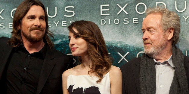 Christian Bale, Maria Valverde and Ridley Scott pose for photographers during the premiere of the film 'Exodus' in Madrid, on Thursday Dec. 4, 2014. (AP Photo/Abraham Caro Marin)