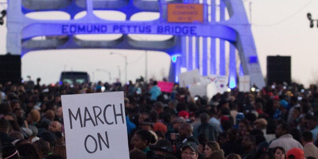 SELMA, AL - JANUARY 18: A view of marchers as they assemble on the Edmund Pettus Bridge to commemorate the life of Dr. Martin Luther King, Jr. on January 18, 2015 in Selma, Alabama. (Photo by David A. Smith/Getty Images)