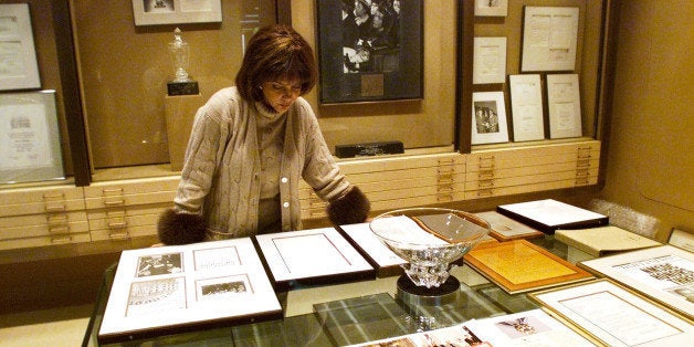 Linda Johnson Rice, president and chief operating officer of Jet magazine, looks over awards and recognitions won by the maga