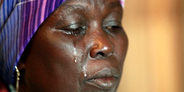 In this photo taken on Monday, May 19, 2014. Martha Mark, the mother of kidnapped school girl Monica Mark cries, in the family house, in Chibok, Nigeria. More than 200 schoolgirls were kidnapped from a school in Chibok in Nigeria's north-eastern state of Borno on April 14. Boko Haram claimed responsibility for the act. (AP Photo/Sunday Alamba)