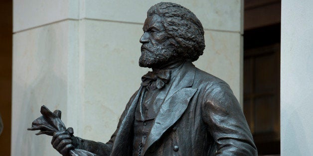 UNITED STATES - June 19: The Fredrick Douglass statue sits in the Emancipation Hall in the Capitol Visitors Center of the U.S. Capitol during a dedication ceremony on June 19, 2013. (Photo By Douglas Graham/CQ Roll Call)