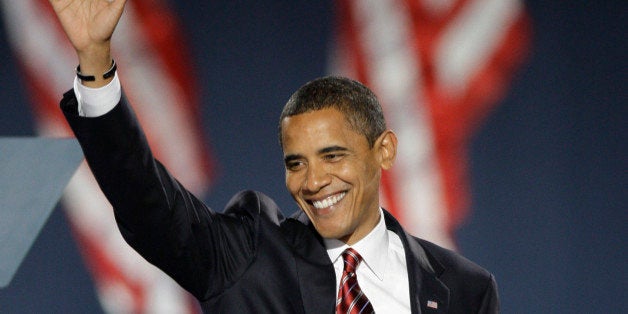 President-elect Barack Obama waves as he takes the stage at his election night party in Chicago's Grant Park, Tuesday, Nov. 4, 2008. (AP Photo/Morry Gash)