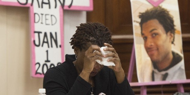 Tressa Sherrod cries after telling the story of her son, 22-year-old John Crawford III who was shot and killed by police in an Ohio Walmart, during a press conference with other mothers who have lost children due to police action as they call for police accountability and reform on Capitol Hill in Washington, DC, December 10, 2014. Representatives from Mothers Against Police Brutality, Codepink, National Congress of Black Women and the Hands Up DC Coalition brought together 10 mothers who have had children killed to lobby Congress for police reform and accountability. AFP PHOTO / SAUL LOEB (Photo credit should read SAUL LOEB/AFP/Getty Images)