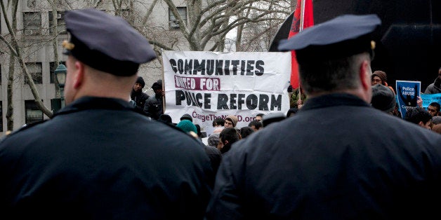 NEW YORK, NY - MARCH 18: New York CIty Police officers watch over a demonstration against the city's 'stop and frisk' searches in lower Manhattan near Federal Court March 18, 2013 in New York City. Hearings in a federal lawsuit filed by four black men against the city police department's 'stop and frisk' searches starts today in Manhattan Federal Court. (Photo by Allison Joyce/Getty Images)