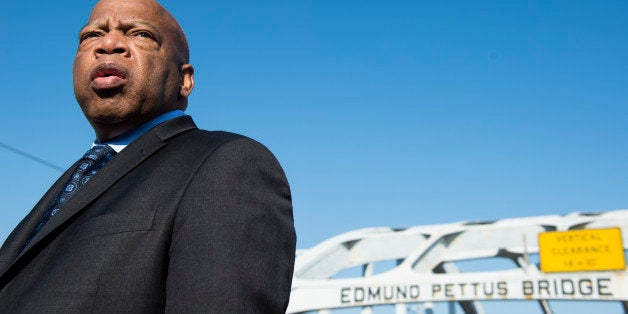 UNITED STATES - FEBRUARY 14: Rep. John Lewis, D-Ga., stands on the Edmund Pettus Bridge in Selma, Ala., in between television