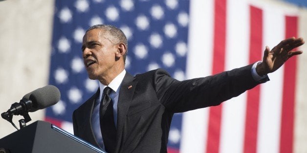 US President Barack Obama speaks during an event marking the 50th Anniversary of the Selma to Montgomery civil rights marches at the Edmund Pettus Bridge in Selma, Alabama, March 7, 2015. US President Barack Obama rallied a new generation of Americans to the spirit of the civil rights struggle, warning their march for freedom 'is not yet finished.' In a forceful speech in Selma, Alabama on the 50th anniversary of the brutal repression of a peaceful protest, America's first black president denounced new attempts to restrict voting rights. AFP PHOTO/ SAUL LOEB (Photo credit should read SAUL LOEB/AFP/Getty Images)