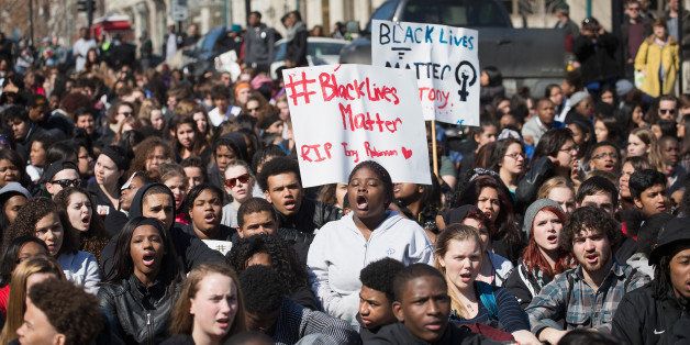 MADISON, WI - MARCH 09: Demonstrators, most of whom are students who walked out of their classrooms today, protest outside of the City Hall building on March 9, 2015 in Madison, Wisconsin. The protestors were angry about the shooting death of 19-year-old Tony Robinson who was killed by Madison Police Officer Matt Kenny during a confrontation on March 6. The demonstrators also marched through the State Capital building during today's protest. (Photo by Scott Olson/Getty Images)