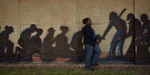 Letasha Irby, a worker who still sees challenges and inequality in the present day US, poses for a portrait on March 5, 2015 in Selma, Alabama. Saturday will mark the 50th anniversary of Bloody Sunday where civil rights marchers attempting to walk to the Alabama capitol in Montgomery for voters' rights clashed with police on the Edmund Pettus Bridge. AFP PHOTO/ BRENDAN SMIALOWSKI (Photo credit should read BRENDAN SMIALOWSKI/AFP/Getty Images)