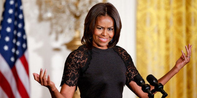 First lady Michelle Obama reacts to cheers from the audience while speaking at an event to mark Nowruz, Wednesday, March 11, 2015, in the East Room of the White House in Washington. Nowruz is the celebration of New Year for over 300 million people across the Middle East, Central and Southwest Asia, and Eastern Europe that marks the beginning of spring. (AP Photo/Andrew Harnik)