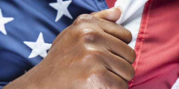 Hand holding american flag.