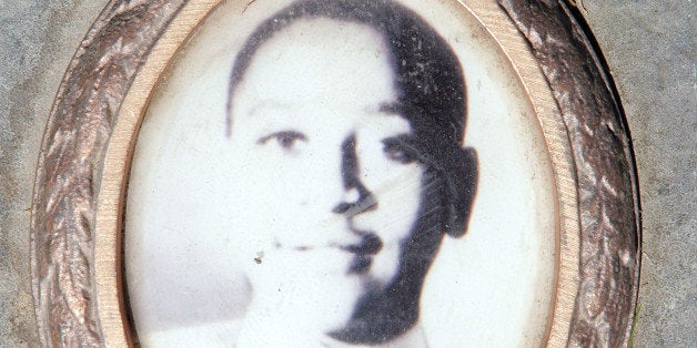 ALSIP, IL - MAY 4: A photo of Emmett Till is included on the plaque that marks his gravesite at Burr Oak Cemetery May 4, 2005 in Aslip, Illinois. The FBI is considering exhuming the body of Till, whose unsolved 1955 murder in Money, Mississippi, after whistling at a white woman helped spark the U.S. civil rights movement. (Photo by Scott Olson/Getty Images)