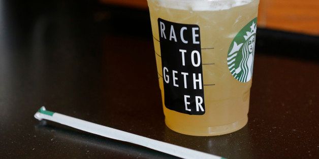 A Starbucks iced drink with a "Race Together" sticker on it is shown ready for pickup at a Starbucks store in Seattle, Wednesday, March 18, 2015. Starbucks CEO Howard Schultz announced earlier in the day at the company's annual shareholder meeting that participating baristas at stores in the U.S. will be putting the stickers on cups and also writing the words "#RaceTogether" for customers in an effort to raise awareness and discussion of race relations. (AP Photo/Ted S. Warren)