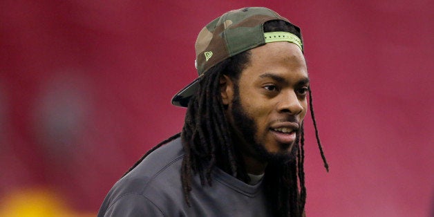 Seattle Seahawks' Richard Sherman arrives for a team walk through for NFL Super Bowl XLIX football game, Saturday, Jan. 31, 2